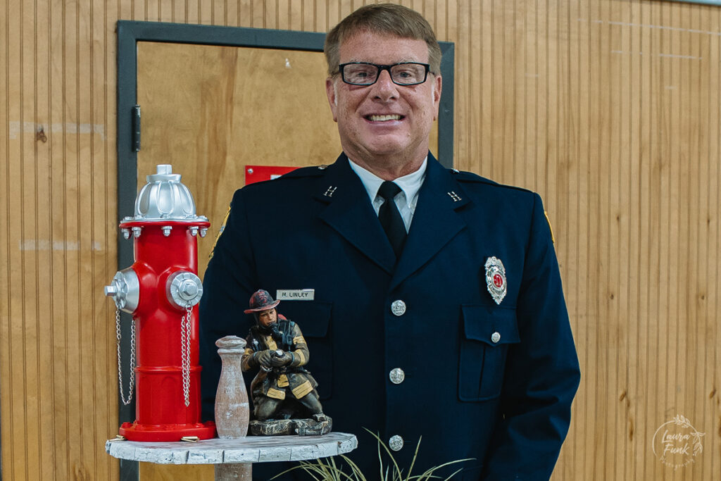 firefighter retirement party man posing for photo