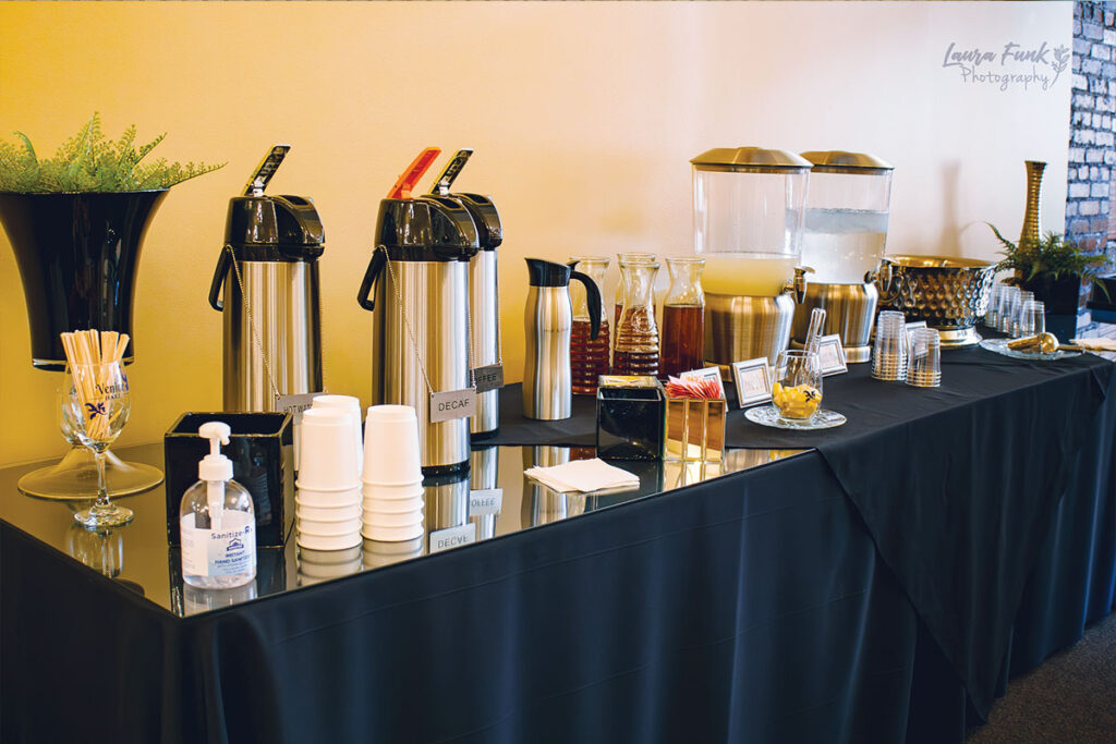 a table filled with drinks for an anniversary party