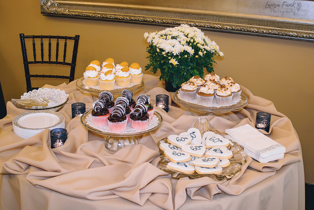 table setting of desserts for an anniversary party