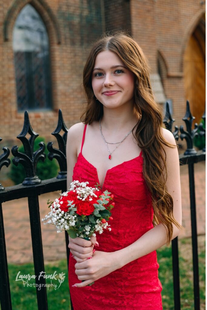 girl in red dress with flowers