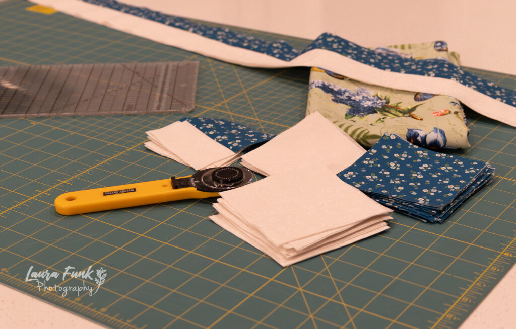 table with quilting supplies on it for business shot.